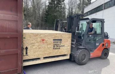 Large vault door in a wooden carton box